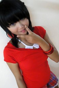 a asian lady dressed in a yellow dress having fucky-fucky on the couch